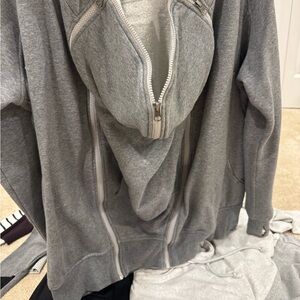 Seraphine Large baby wearing maternity hooded sweatshirt